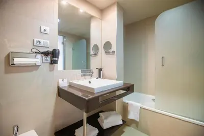 a bathroom with a sink and a mirror at Itaca Jerez by Soho Boutique in Jerez de la Frontera