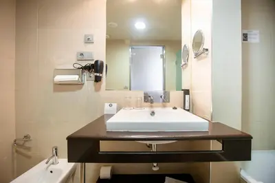 a bathroom with a sink and a mirror at Itaca Jerez by Soho Boutique in Jerez de la Frontera