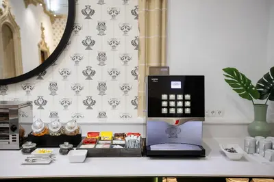 a desk with a laptop on top of a counter at Itaca Jerez by Soho Boutique in Jerez de la Frontera