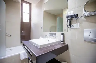 a bathroom with a sink and a mirror at Itaca Jerez by Soho Boutique in Jerez de la Frontera