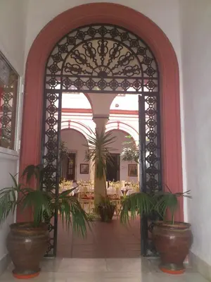 an entrance to a building with two potted plants at Hotel Marqués de Torresoto by Vivere Stays in Arcos de la Frontera