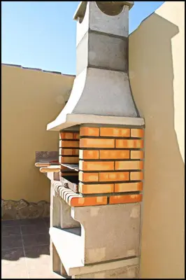 a stack of bricks on the side of a building at Bungalow Curro Pareja 131 in Conil de la Frontera