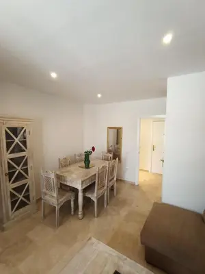 a dining room with a table and chairs at Azvalia - Ático Larga 112 - Terraza in El Puerto de Santa María