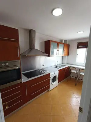 a kitchen with a stove and a washer and sink at Azvalia - Ático Larga 112 - Terraza in El Puerto de Santa María