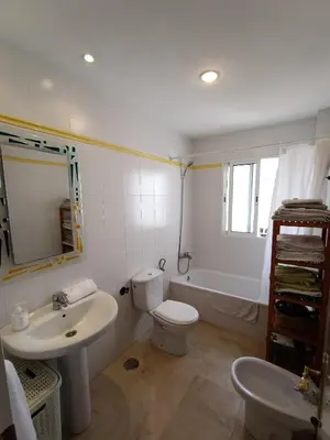 a bathroom with a toilet and a sink and a tub at Azvalia - Ático Larga 112 - Terraza in El Puerto de Santa María
