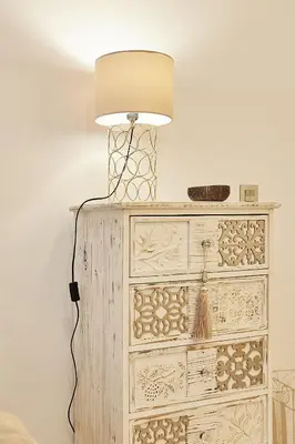 a lamp sitting on top of a dresser at Little Arboli Little Apartments in Cádiz