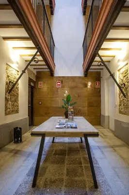 a table in the middle of a room at Apartamentos Maier in Cádiz