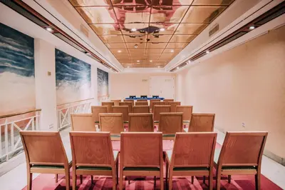 a conference room with chairs and a podium in it at Hotel Playa Victoria in Cádiz