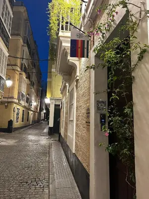 an empty street in a city at night at Palacete de La Alameda - Adults Only- in Cádiz