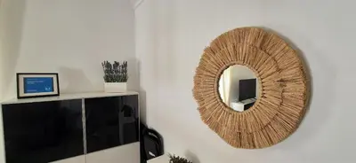 a mirror on a wall in a room at Sopranis by Gades Gestión in Cádiz