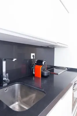 a kitchen counter top with a sink and a sink at Sopranis by Gades Gestión in Cádiz