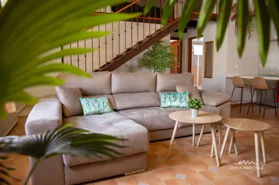 a living room with a couch and tables at Jerez Centro MRZ Rentals in Jerez de la Frontera