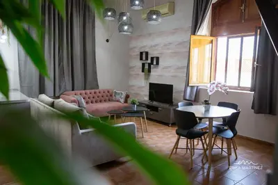 a living room with a couch and a table at Jerez Centro MRZ Rentals in Jerez de la Frontera