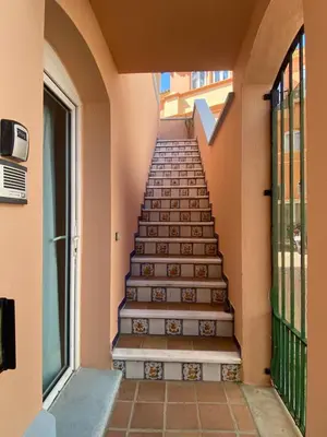 a stairway leading up to a building at Apartamento Playa Muralla in El Puerto de Santa María