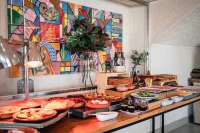 a buffet line with many different types of food at Hotel Puerto Sherry in El Puerto de Santa María