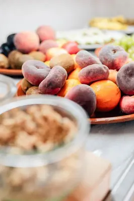 a table topped with plates of fruits and vegetables at Hotel Puerto Sherry in El Puerto de Santa María
