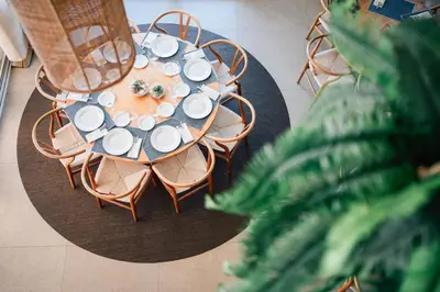 an overhead view of a table with chairs and plates at Hotel Puerto Sherry in El Puerto de Santa María
