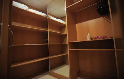 a walk in closet with a glass door at Gran Hotel Ciudad Del Sur in Puerto Real