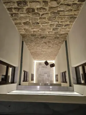 a room with a stone ceiling and windows at Hotel YIT Casa Grande in Jerez de la Frontera
