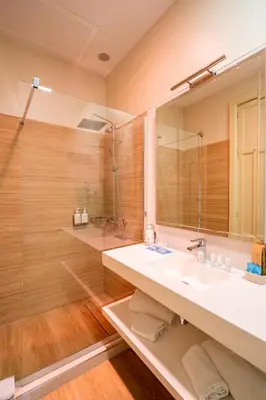 a bathroom with a sink and a mirror at Hotel YIT Casa Grande in Jerez de la Frontera