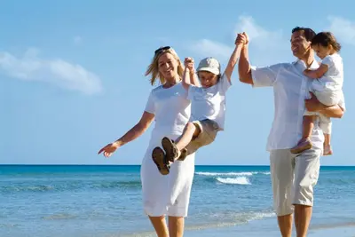 a family walking on the beach at Aldiana Club Andalusien in Chiclana de la Frontera