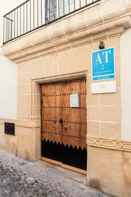 a building with a door with a sign on it at Casa Seven Jerez in Jerez de la Frontera