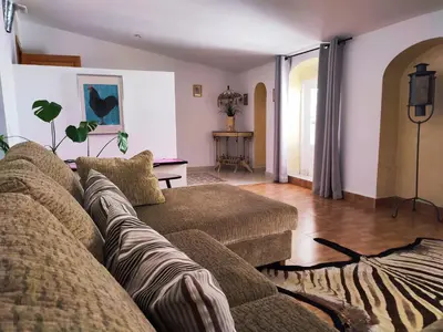 a living room with a couch and a table at Casa Seven Jerez in Jerez de la Frontera
