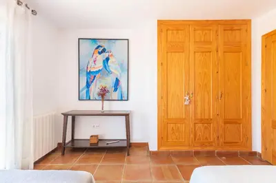 a room with a wooden door and a table at Villa Golf Sanlucar in Sanlúcar de Barrameda