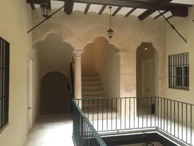 a hallway of a building with a staircase at Apartamentos Aloha 2 Centro El Puerto de Santa Maria in El Puerto de Santa María