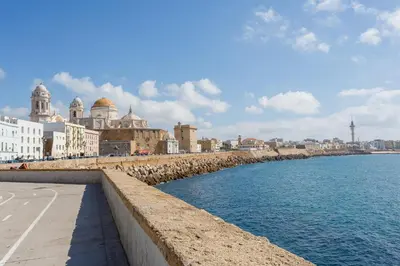 a view of a city with the ocean and buildings at Casa ALEGRIA by Cadiz4Rentals in Cádiz