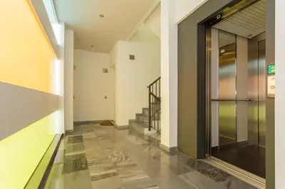 a hallway with stairs and a glass door at Apartamento La PALMA free parking by Cadiz4Rentals in Cádiz