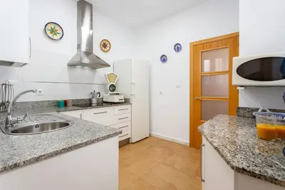 a kitchen with a sink and a microwave at El Balcon de MORET by Cadiz4Rentals in Cádiz