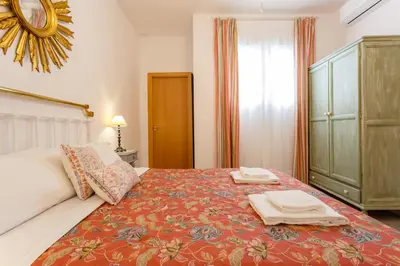 a bedroom with a bed with two towels on it at El Balcon de MORET by Cadiz4Rentals in Cádiz