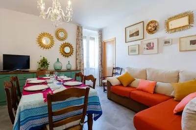 a living room with a table and a couch at El Balcon de MORET by Cadiz4Rentals in Cádiz