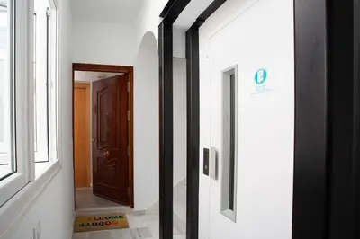 a hallway with a door and a mirror at El Balcon de MORET by Cadiz4Rentals in Cádiz