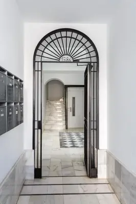 an open hallway with an archway in a building at El Balcon de MORET by Cadiz4Rentals in Cádiz
