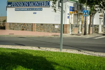 a sign for a museum on the side of a street at Pensión Montero in Jedula
