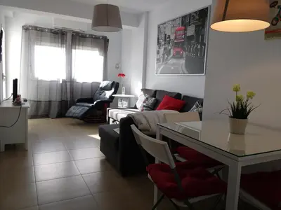 a living room with a couch and a table at Apartamento Fernández Ladreda in Cádiz