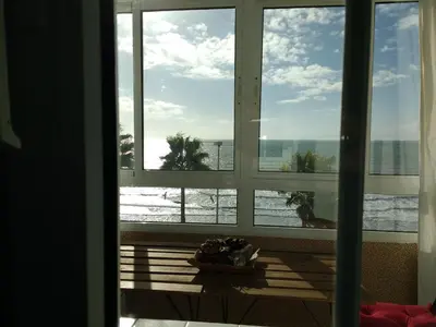 a window view of the ocean from a hotel room at Apartamento Fernández Ladreda in Cádiz