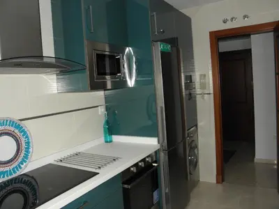 a kitchen with a sink and a microwave at Apartamento en Jerez de la Frontera 2 in Jerez de la Frontera