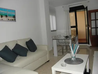 a living room with a couch and a table at Apartamento en Jerez de la Frontera 2 in Jerez de la Frontera