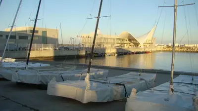 a group of sailboats covered in tarps in a harbor at Apartamento Marina el Puerto in El Puerto de Santa María