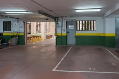 an empty parking garage with green and yellow stripes at Casita Coqueta Free Parking in Cádiz