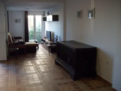a living room with a couch and a table and chairs at Apartamento Caballo Sherry in El Puerto de Santa María