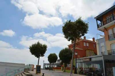 a street with trees in front of a building at Casita de María in El Puerto de Santa María