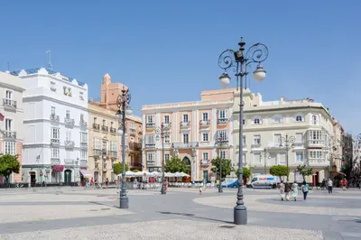 a city street with many buildings and a street light at El Atico de las MARINAS free Parking by Cadiz4Rentals in Cádiz