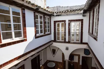 an external view of a building with windows at Hotel Carlos V Jerez by Vivere Stays in Jerez de la Frontera