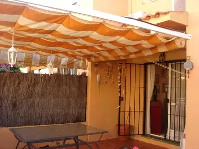 awning over a front door of a house at Chalet Pto Sta Maria, SOLO FAMILIAS in El Puerto de Santa María