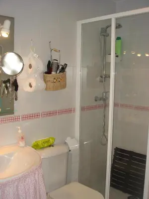 a bathroom with a shower and a toilet and a sink at Chalet Pto Sta Maria, SOLO FAMILIAS in El Puerto de Santa María
