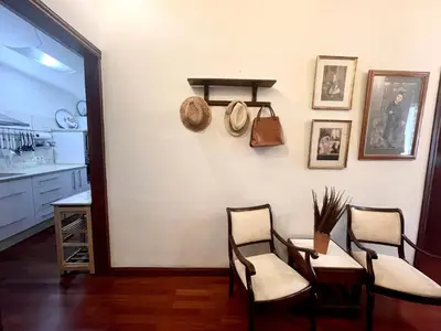 a dining room with two chairs and a table at Eva Recommends Porvenir Apartment in Jerez de la Frontera